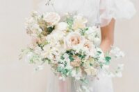 a subtle wedding bouquet of blush roses, poppies, white sweet peas and some greenery is amazing for spring or summer