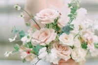 a tender blush and neutral wedding bouquet with textural greenery is perfect for a romantic spring bride