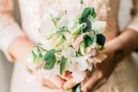 a tiny sweet peas wedding bouquet of blush and white blooms and leaves is a cool idea for a cute and small wedding