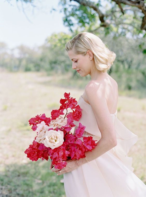 an elegant wedding bouquet of blush roses and bougainvillear is a cool idea for a summer wedding infused with color
