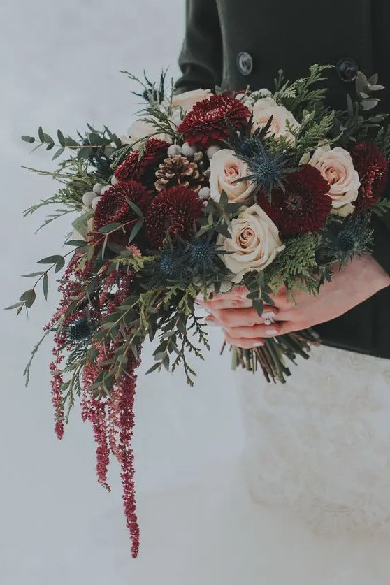 bouquet with hanging burgundy amaranthus, pomponis, silver brunia, thistles, blush roses and winter foliage