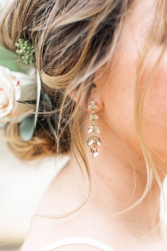 delicate yet chic crystal wedding earrings forming flowers and leaves are adorable for a chic and romantic bridal look