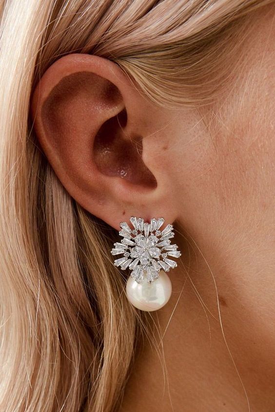 gorgeous and refined crystal and large pearl earrings are amazing for a modern glam bride