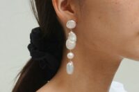 long baroque pearl earrings are adorable for a modern or minimalist bride, they make an accent