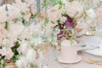 lush dimensional wedding centerpieces of blush roses, peony roses and sweet pears plus some greenery and lavender for a French chateau wedding