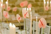 modern wedding centerpieces of pink anthurims and candles are amazing for a modern or minimalist weddings