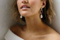 statement minimalist gold and baroque pearl earrings will spruce up any, even the most minimal, bridal look