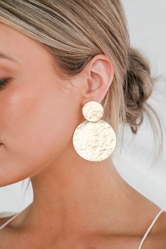 such gold round earrings are great for a modern or minimalist bride, they will accent your look in a lovely way