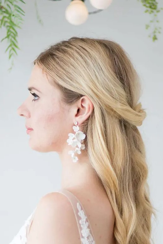 super delicate and chic white flower cascading bridal earrings are amazing to finsih off an airy and lovely birdal look