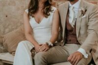 09 a greige pantsuit, a brown waistcoat, a white shirt, a white tie and white laofers are a cool and chic look for a modern wedding