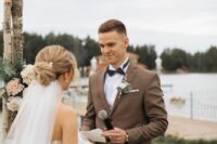 11 a brown pantsuit, a white shirt, a black bow tie and a boutonniere are a cool combo for a modern rustic groom’s look