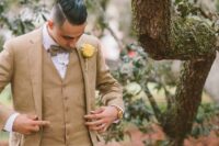 38 a three-piece beige pantsuit, a white shirt, a beige bow tie and a yellow rose boutonniere for a spring wedding