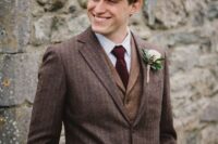 42 a vintage-inspired groom’s look with a striped pantsuit, a rust-colored waistcoat, a white shirt and a burgundy tie for the fall