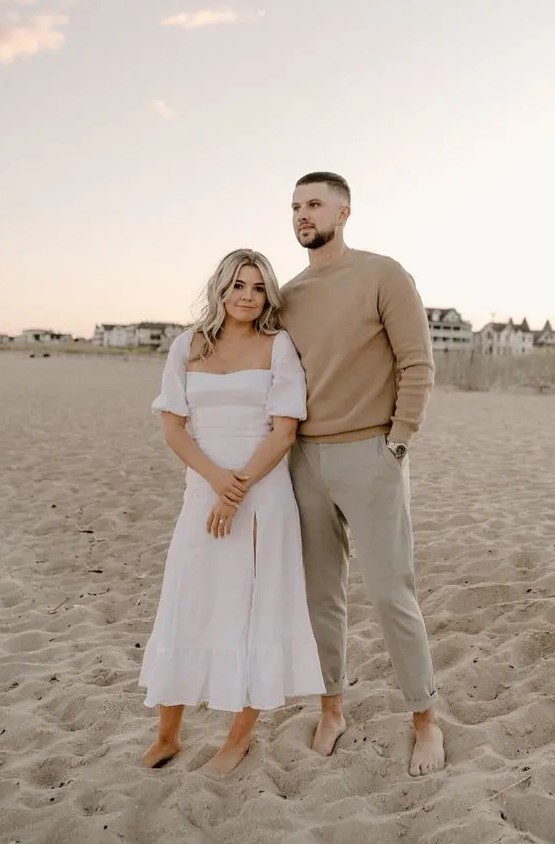 a casual beach groom's look with a tan sweater and grey pants is a lovely idea for a modern beach wedding