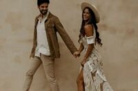 45 a lovely boho groom’s look with a neutral shirt, tan pants, black shoes and a brown leather jacket for a desert wedding