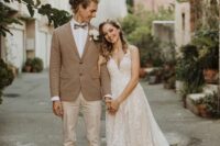 46 a relaxed groom’s look with a white shirt, tan pants, a beige blazer, a printed bow tie and brown shoes for a boho wedding