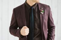 a stylish moody groom’s outfit