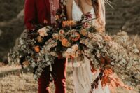 a bold groom’s outfit with a deep red pantsuit, a pink printed shirt, amber shoes is a catchy idea for a boho wedding