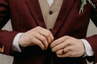 a chic groom’s look with a burgundy woolen suit, a beige waistcoat, a polka dot shirt and a tan bow tie
