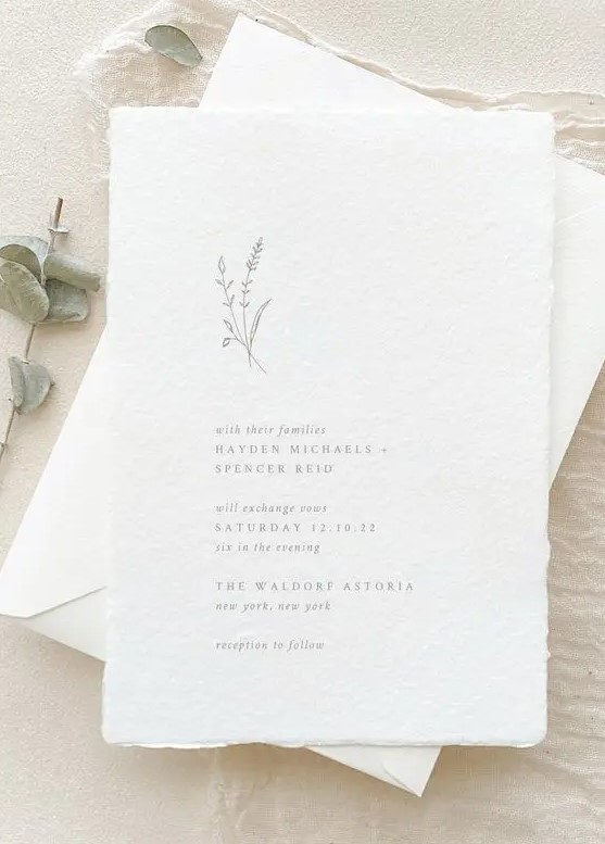 a delicate and ethereal minimalist wedding invitation suite with textural paper and grey lettering is a gorgeous idea for a minimal wedding