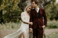 a fall groom’s outfit with a burgundy suit, a graphite grey waistcoat, a printed tie, brown shoes is a lovely idea