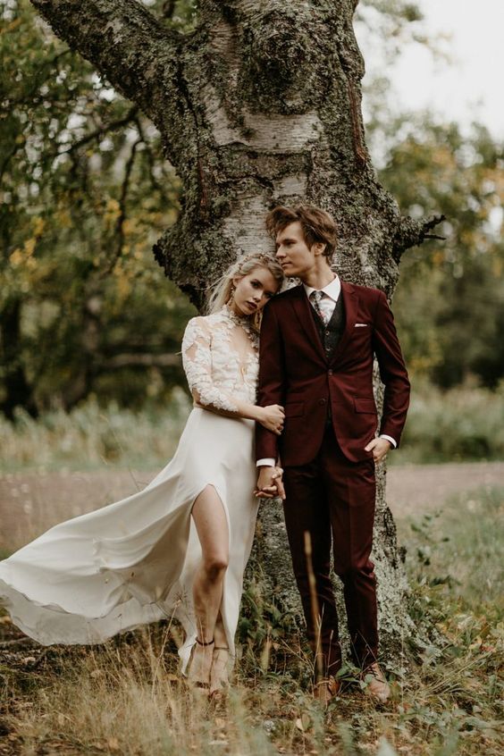 a fall groom's outfit with a burgundy suit, a graphite grey waistcoat, a printed tie, brown shoes is a lovely idea