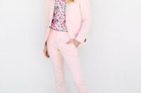 a fun pink groom’s suit, a bright floral shirt, a pink bow tie and white moccasins for a whimsy wedding