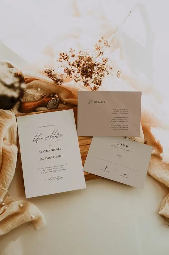 a grey and taupe minimalist wedding invitation suite with calligraphy and black lettering is a great idea for a minimal wedding