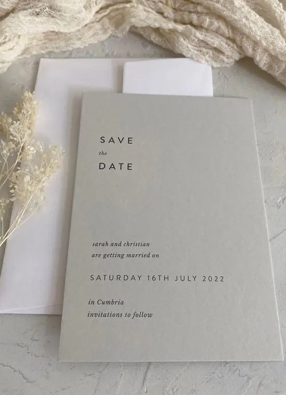 a light grey save the date and a white envelope will set the tone for your neutral minimalist wedding easily