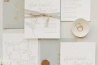 a lovely neutral wedding invitation suite with grey envelopes, white invitations with grey fabric ribbon and a hand painted map