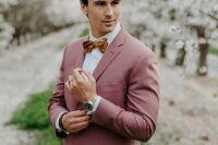 a mauve to pink pantsuit, a white shirt, a rust-colored velvet bow tie are a great combo for a lovely spring groom’s look