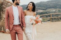 a peachy pink pantsuit, a white shirt and black shoes are a cool combo for a wedding infused with color