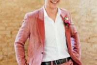 a cute groom’s look with a colorful boutonniere