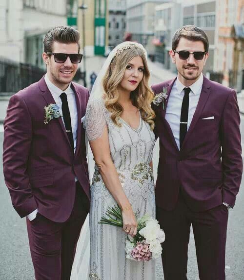 a purple suit, a white shirt, a black tie are a great and bold combo for any bold wedding
