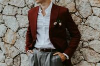 a relaxed groom’s look with a burgundy blazer, grey trousers, a white shirt, a brown belt is great for a more casual wedding