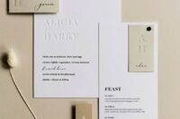 a stylish contemporary to minimalist wedding invitation suite in white and tan, with stylish black letters and letter pressing is chic