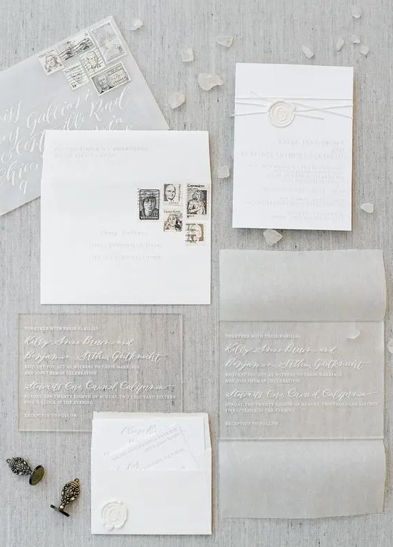 acrylic and paper pressed wedding invitations in sheer envelopes for an ethereal wedding