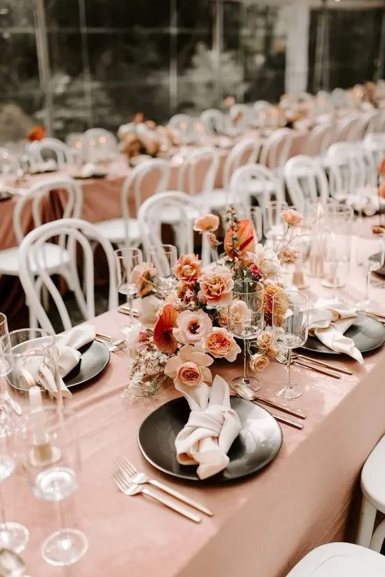 an elegant fall wedding centerpiece with blush, rust and creamy blooms and plenty of texture is timeless
