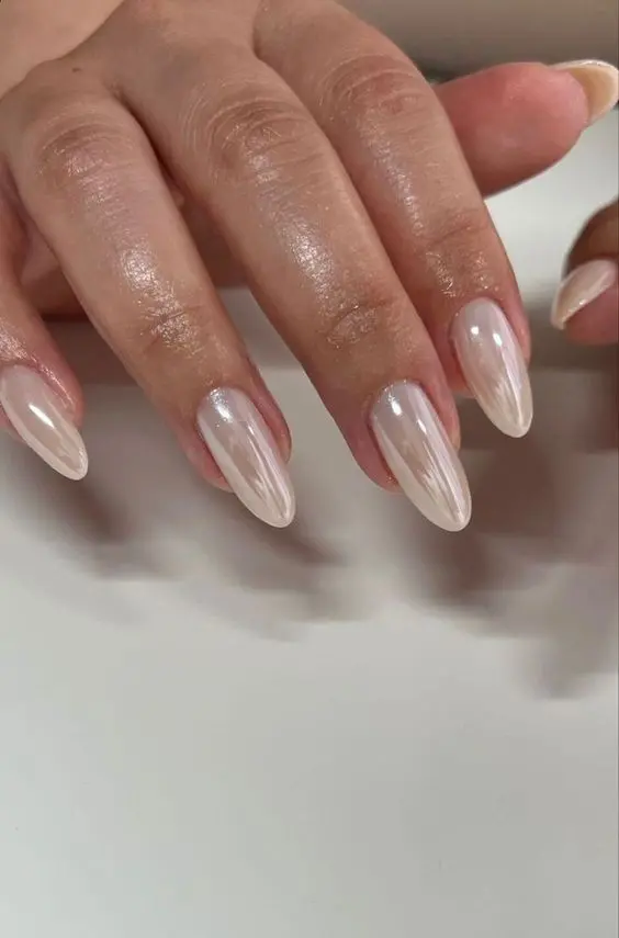 delicate soft neutral chrome nails, long and of an almond shape, will be a gorgeous solution for a wedding