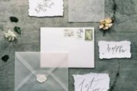 ethereal wedding invitation set in white and grey, with a raw edge, calligraphy and a sheer envelope
