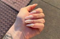 long shimmery blush almond-shaped nails are a cool take on usual blush or nude nails, they look tender yet bold enough