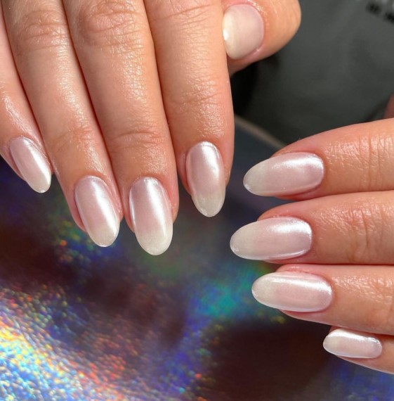shimmery pearl nails of an almond shape are amazing for a wedding, they look shiny, chic and relaxed