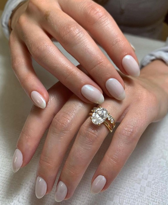 subtle shimmery milky oval-shaped nails like these ones will perfectly finish off your look and are comfortable in wearing