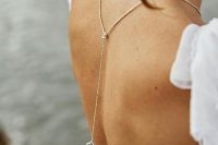 a dainty gold back lariat necklace with a pendant is a lovely way to accent your cutout or open back