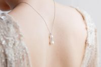 a delicate back necklace with two pearls and beads will accent your open back in the best way possible