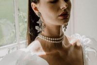 a double pearl choker is a statement idea, and bold floral earrings are an amazing addition, these are a cool combo