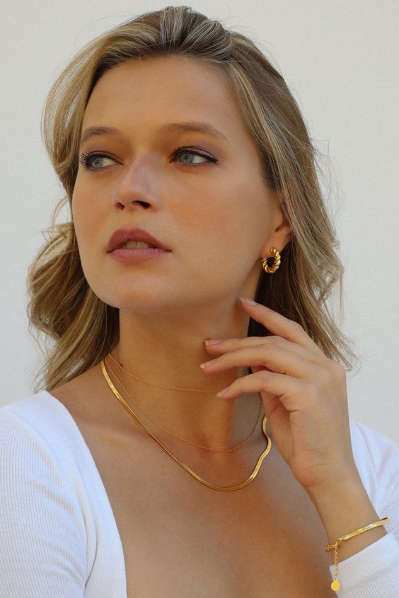 layered gold necklaces, pretty hoop earrings and a gold bracelet are cool jewelry to accessorize your casual bridal look