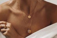 trendy layered necklaces with coins and a little gilded shell are great for a boho bridal look, with a modern feel