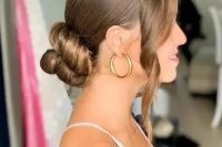 14 a beautiful twisted low bun with a sleek top and some wavy locks framing the face is a cool and chic idea to rock