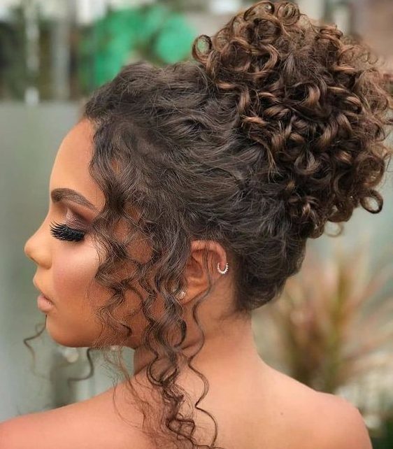a curly top knot with some curls framing the face is a dreamy idea for a lovely take on classics
